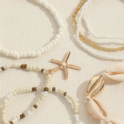 Set de 7 pulseras apilables con estrella de mar – Joyería artesanal de playa con mini cuentas para mujer