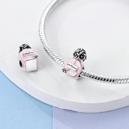 Charm de Plata 925 Rosa con Corazón, Perfume, Lazo y Cruz – Abalorios Elegantes para Pulseras Originales