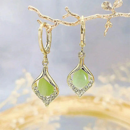 Aretes Coreanos Ojo de Ángel – Aros Dorados con Incrustaciones de Cristales y Diseño Tulipán para Mujer