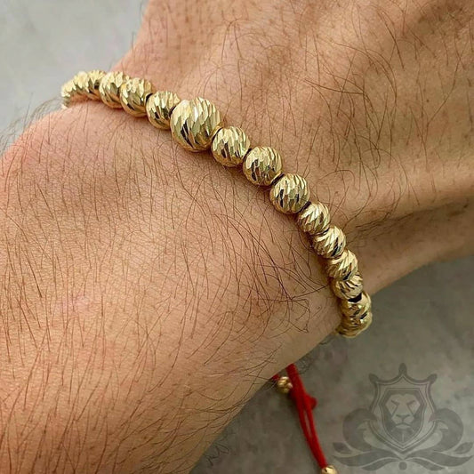 Manilla Tejida de Balines en Oro 18k